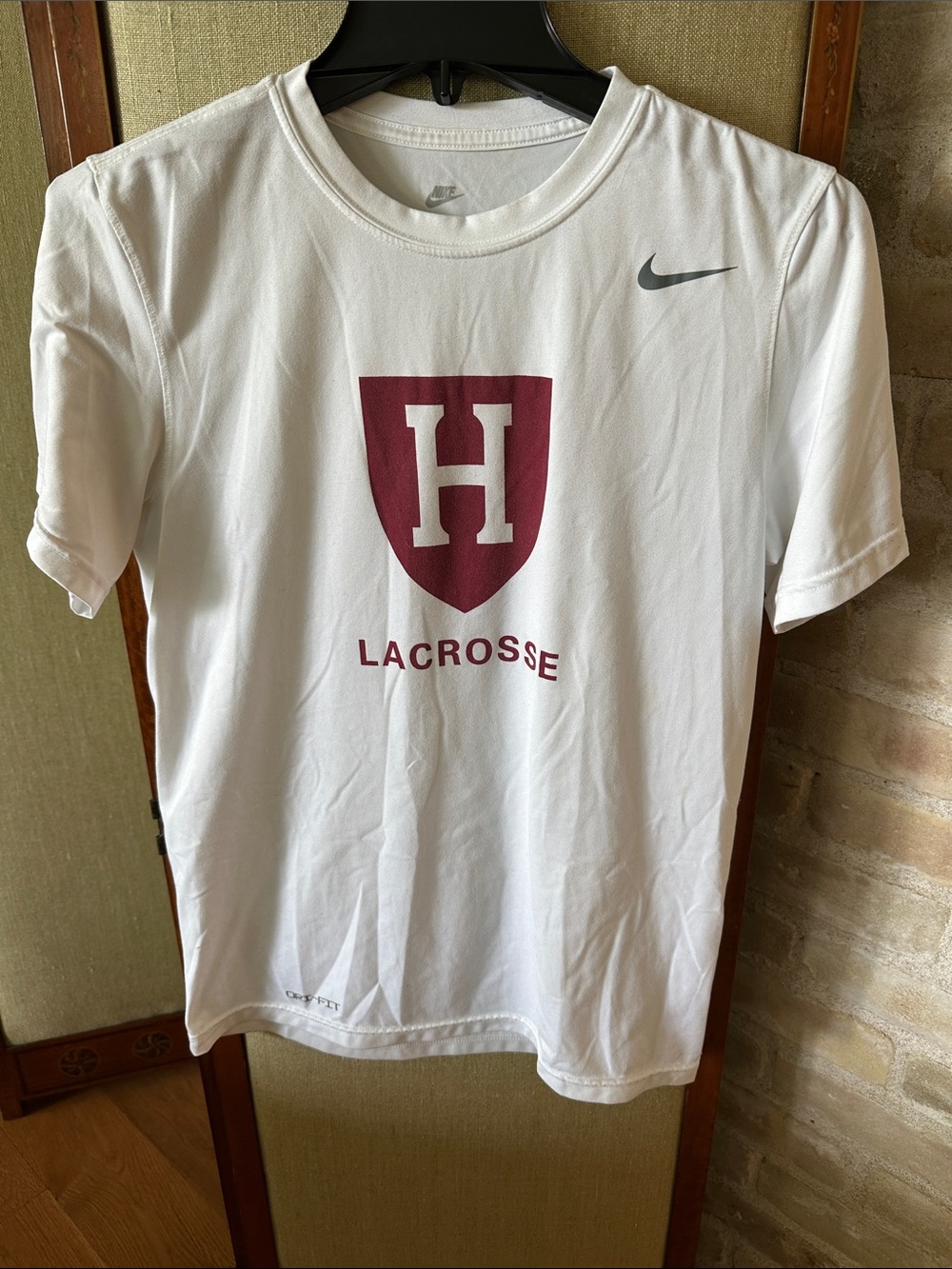 Nike Drifit size small White Tee with Maroon Harvard Shield Lacrosse Logo